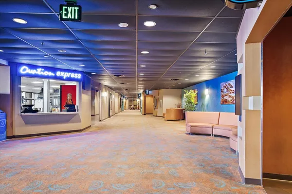 a view of a hall with a flat screen tv
