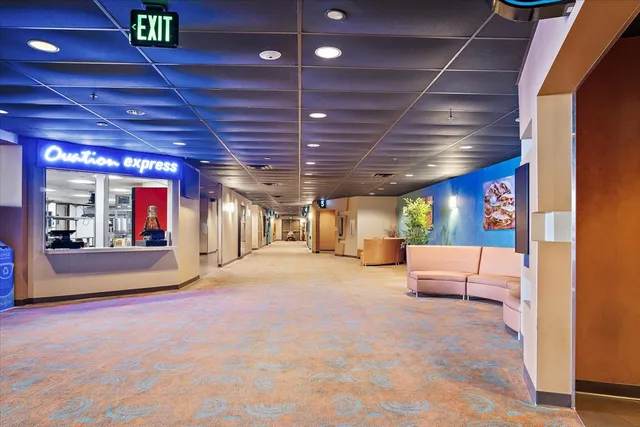 a view of a hall with a flat screen tv