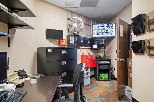 a view of a workspace with furniture