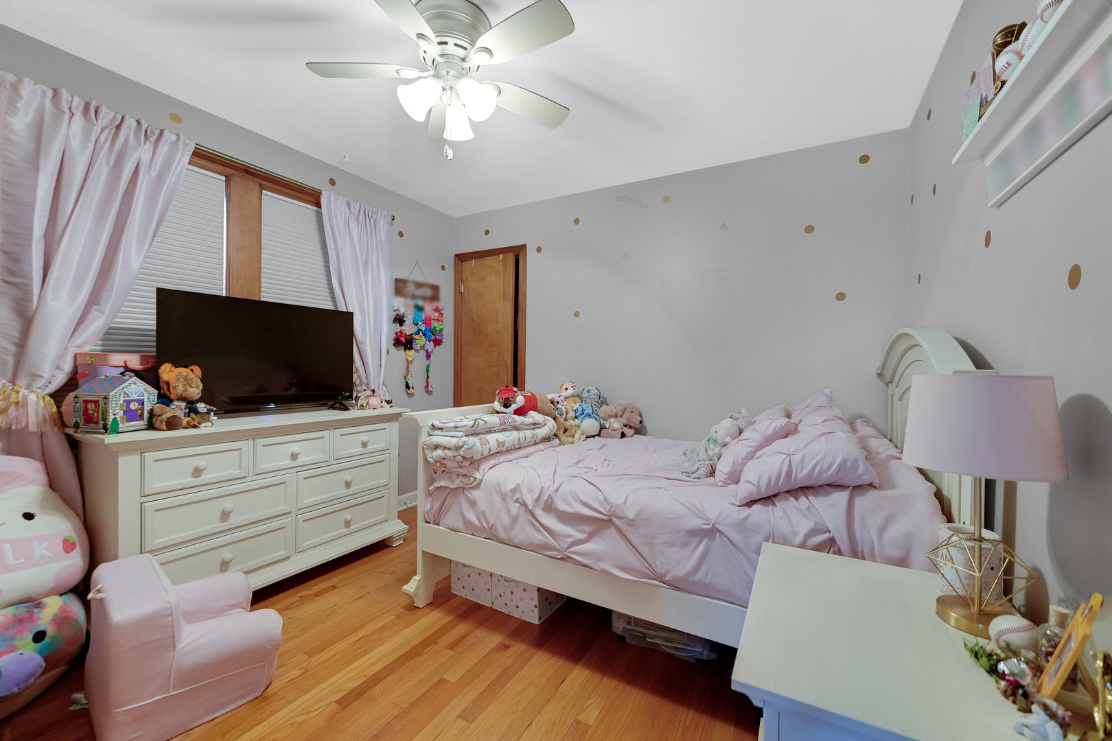5416 South Rutherford Avenue Chicago, IL 60638 - Photo 12 of 25 a bedroom with a bed and flat screen tv