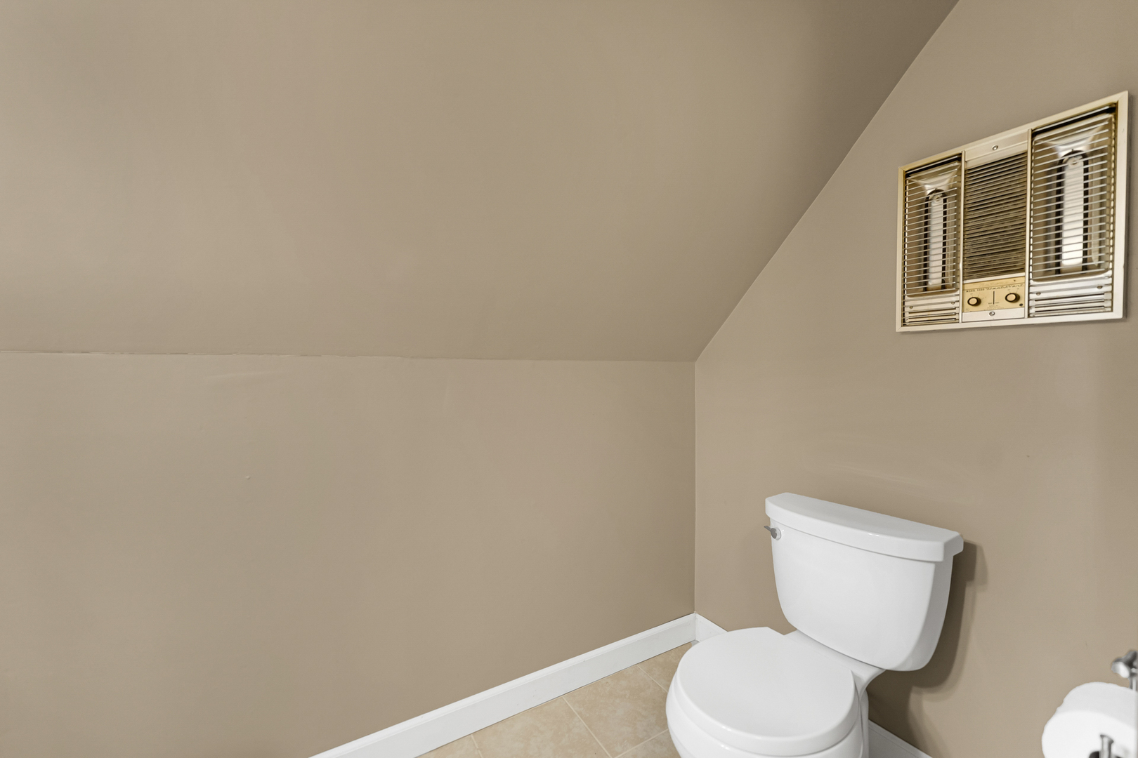 5416 South Rutherford Avenue Chicago, IL 60638 - Photo 17 of 25 a white toilet sitting next to a white wall
