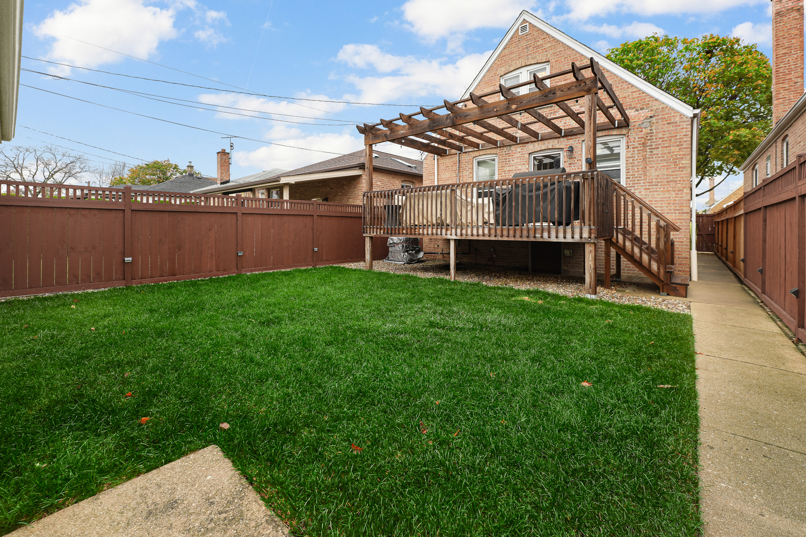 5416 South Rutherford Avenue Chicago, IL 60638 - Photo 23 of 25 a view of a house with a yard and deck