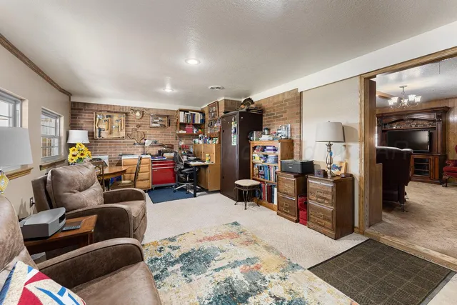 a bedroom with furniture and a window