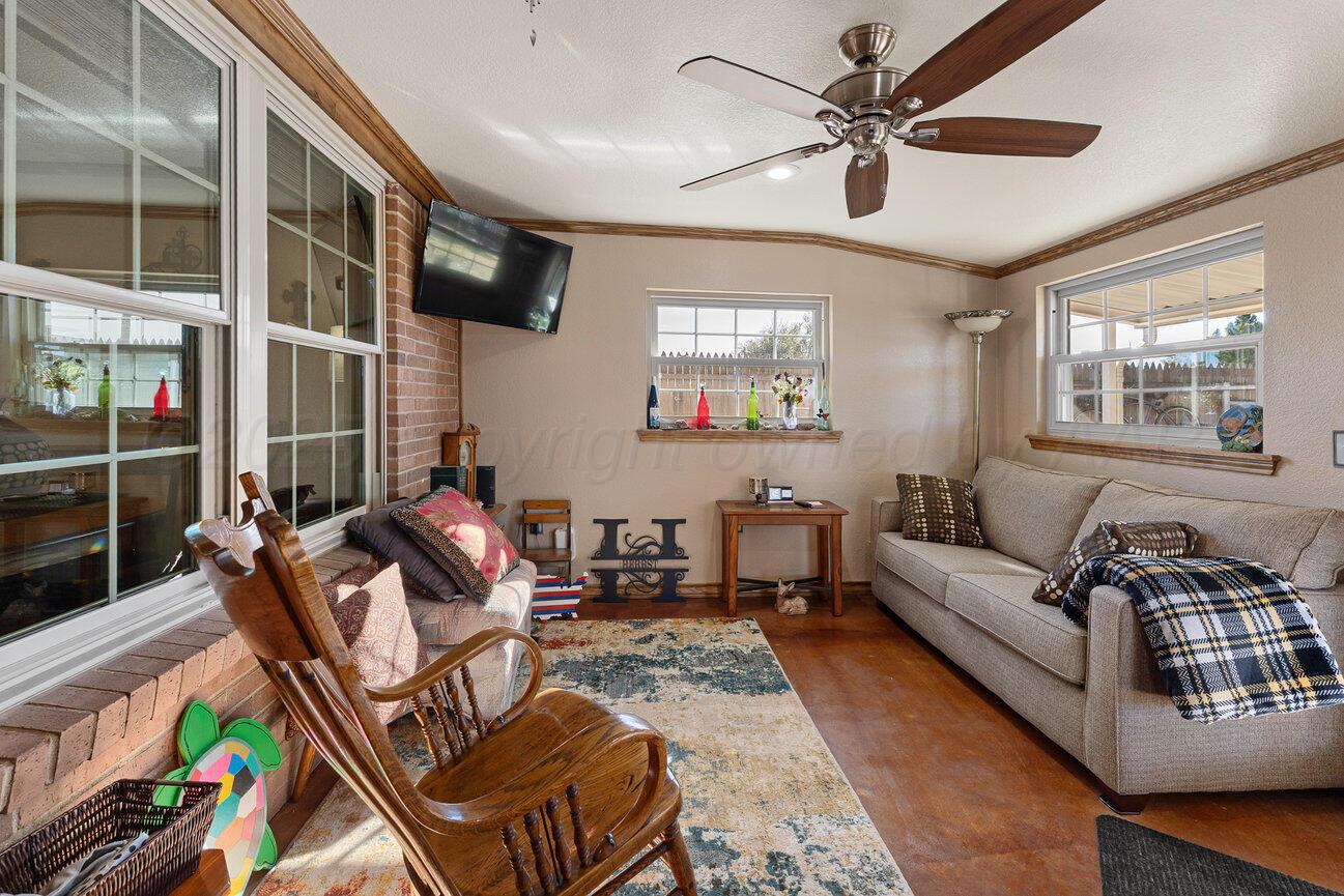 148 Buffalo Trail Fritch, TX 79036 - Photo 25 of 81 a living room with furniture a ceiling fan and a window