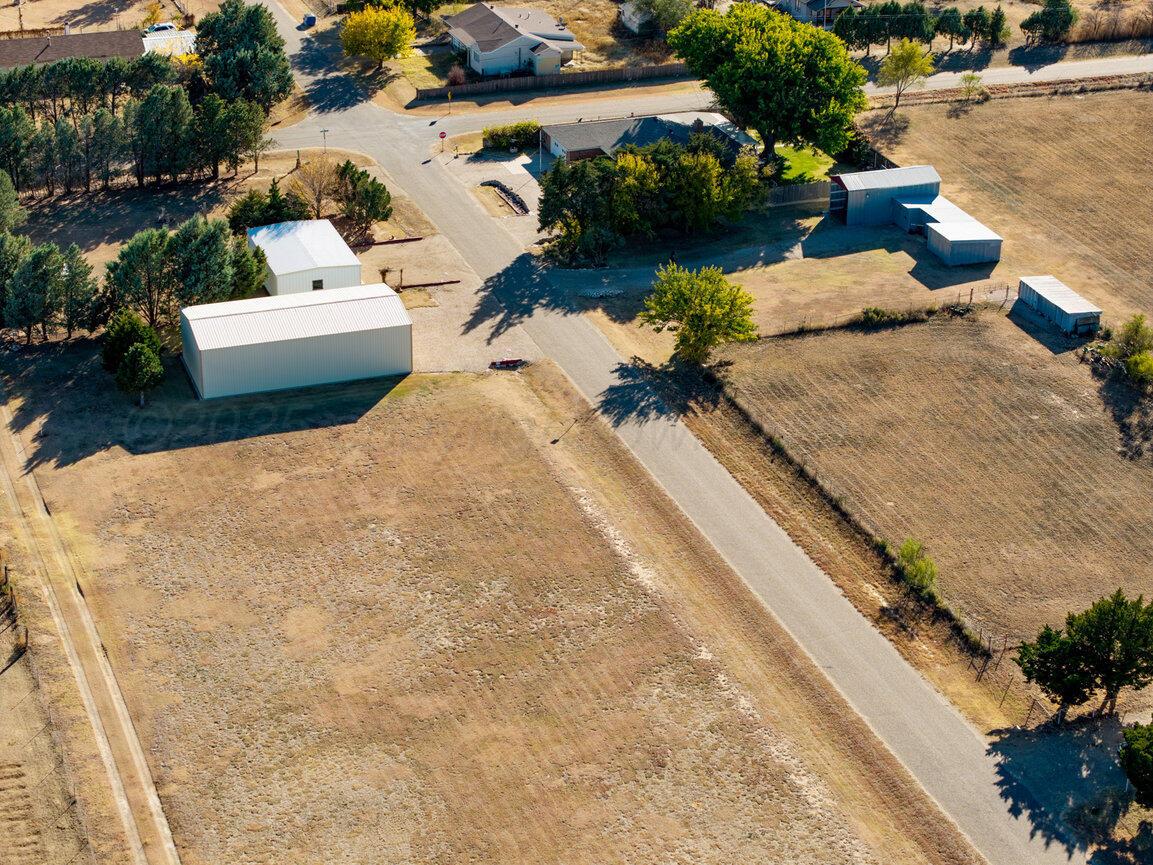 148 Buffalo Trail Fritch, TX 79036 - Photo 64 of 81 an aerial view of a house with a yard and lake view