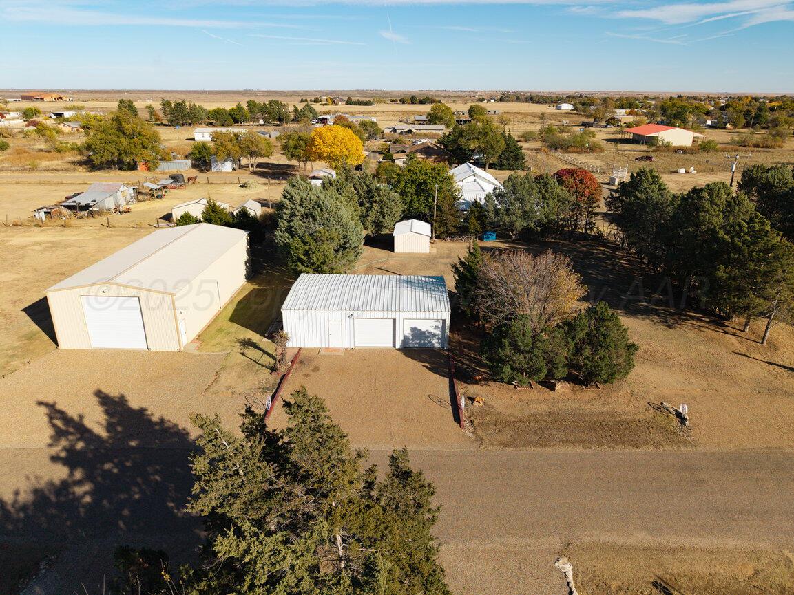 148 Buffalo Trail Fritch, TX 79036 - Photo 66 of 81 an aerial view of a house with a yard and lake view in back