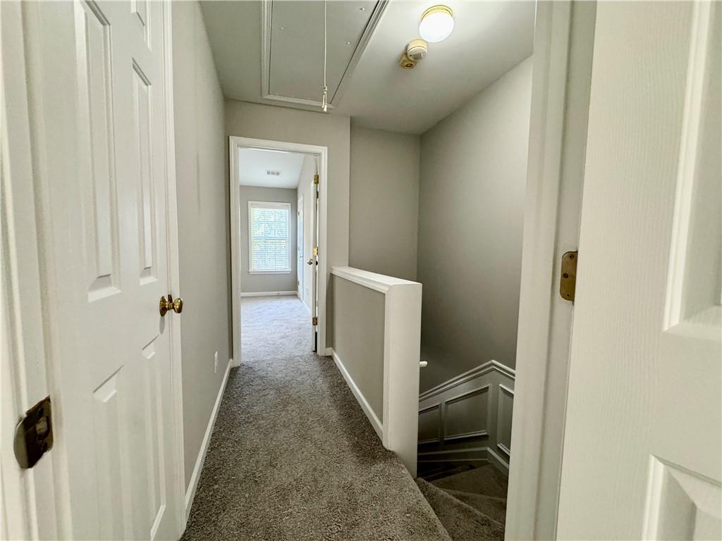 3980 Howell Park Road Duluth, GA 30096 - Photo 18 of 34 a view of a hallway with wooden floor and entryway