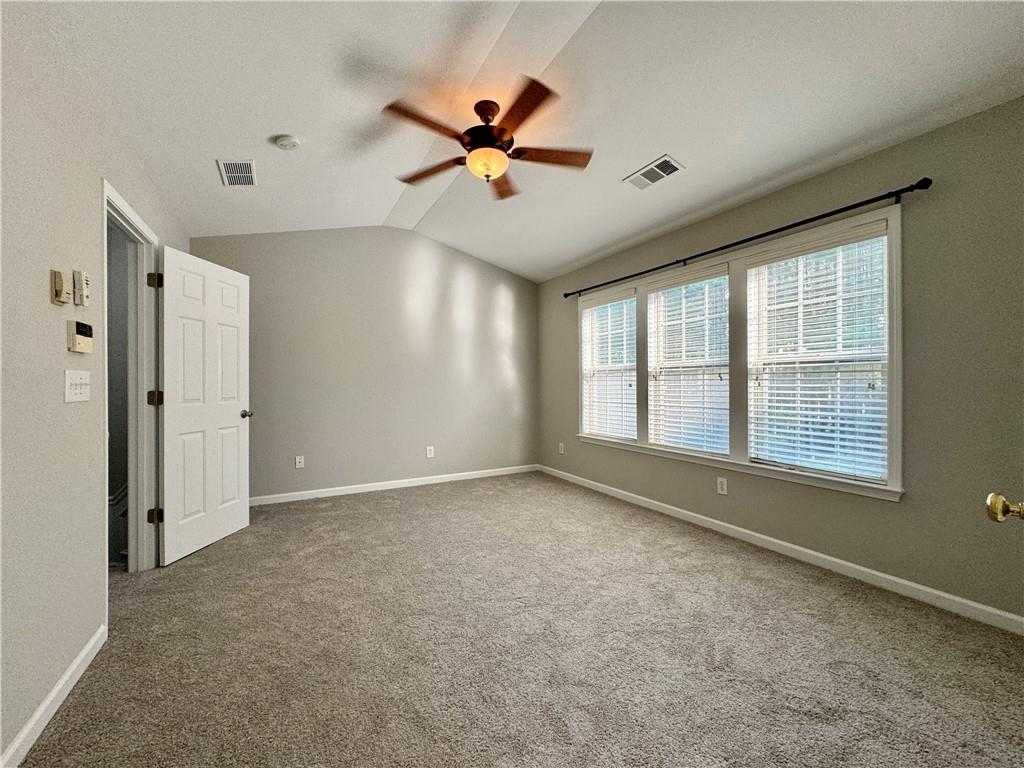 3980 Howell Park Road Duluth, GA 30096 - Photo 20 of 34 a view of a livingroom with a ceiling fan and window