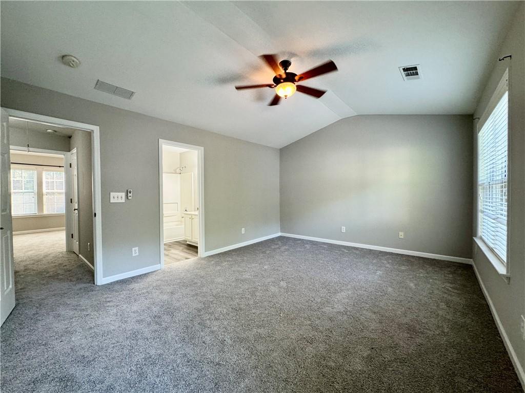 3980 Howell Park Road Duluth, GA 30096 - Photo 22 of 34 an empty room with windows and fan