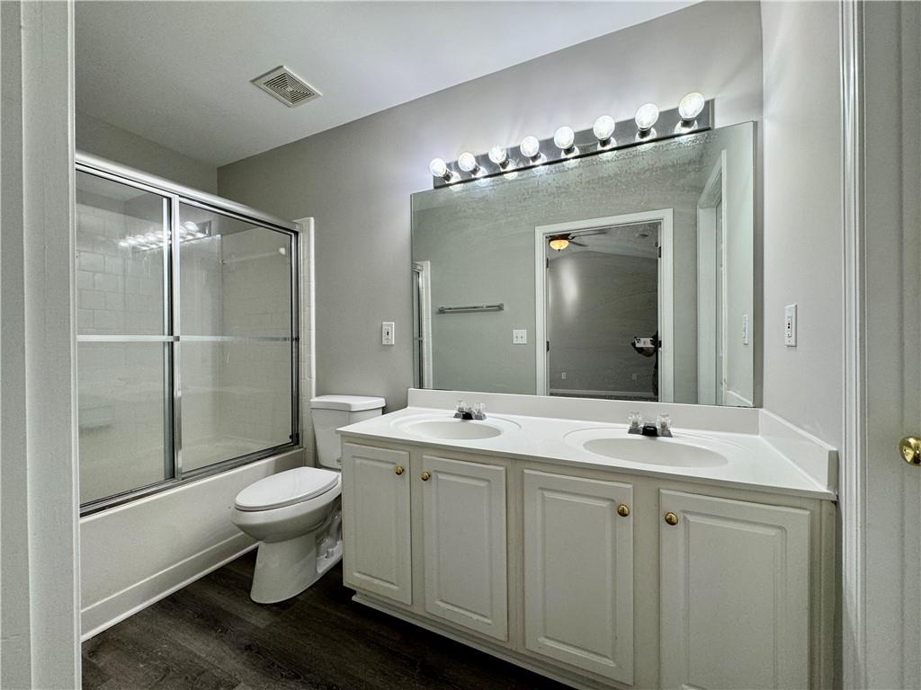 3980 Howell Park Road Duluth, GA 30096 - Photo 27 of 34 a bathroom with a sink toilet and shower