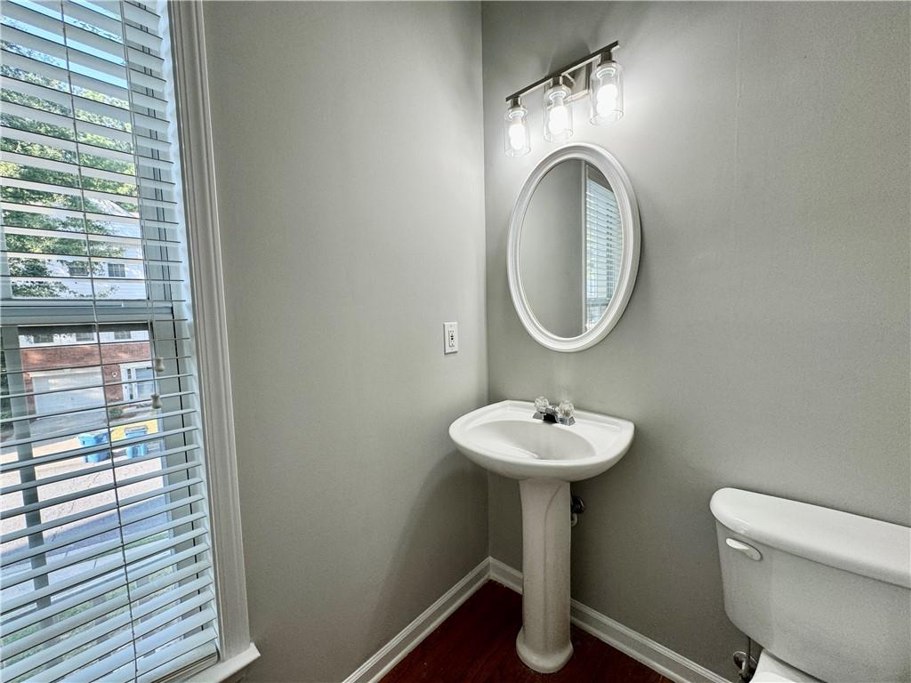 3980 Howell Park Road Duluth, GA 30096 - Photo 29 of 34 a bathroom with a toilet sink and mirror