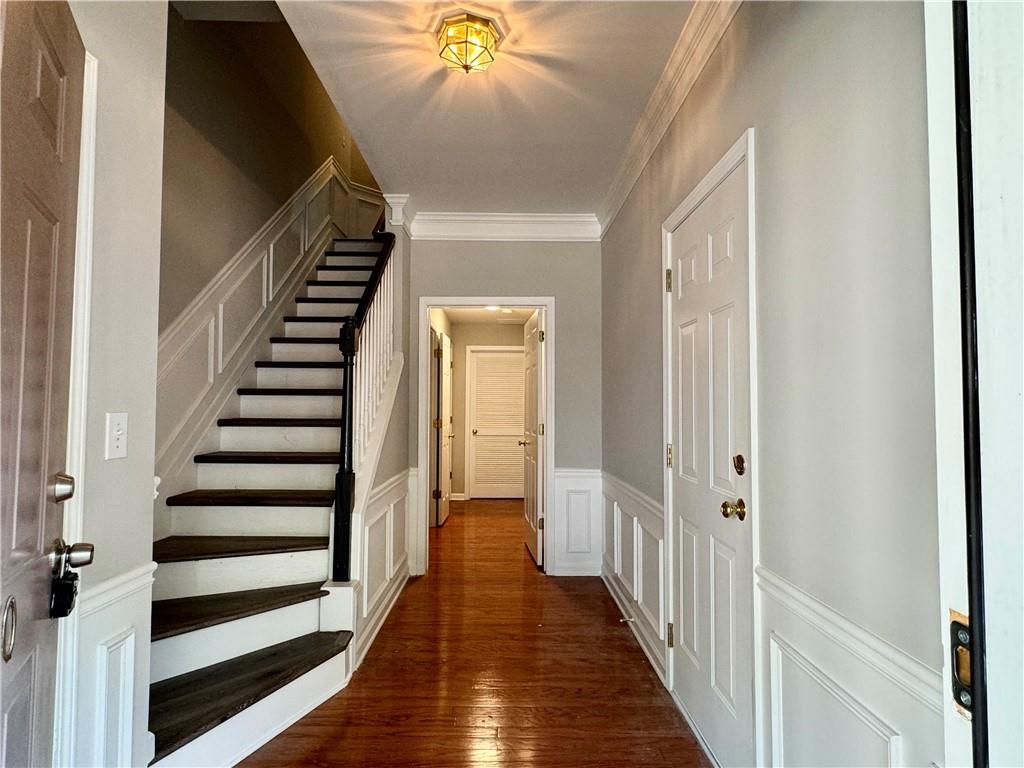 3980 Howell Park Road Duluth, GA 30096 - Photo 4 of 34 a view of a hallway with wooden floor and staircase