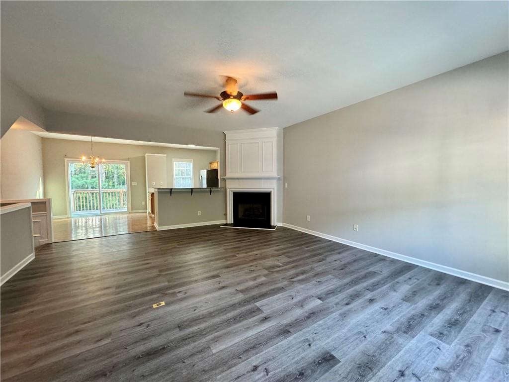 3980 Howell Park Road Duluth, GA 30096 - Photo 7 of 34 wooden floor in an empty room with a window