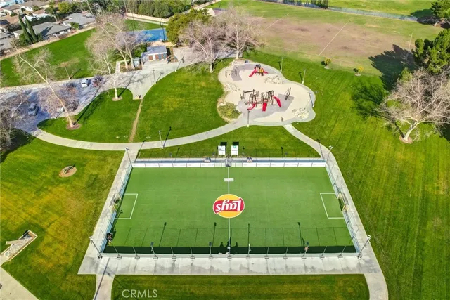 an aerial view of a house with a yard