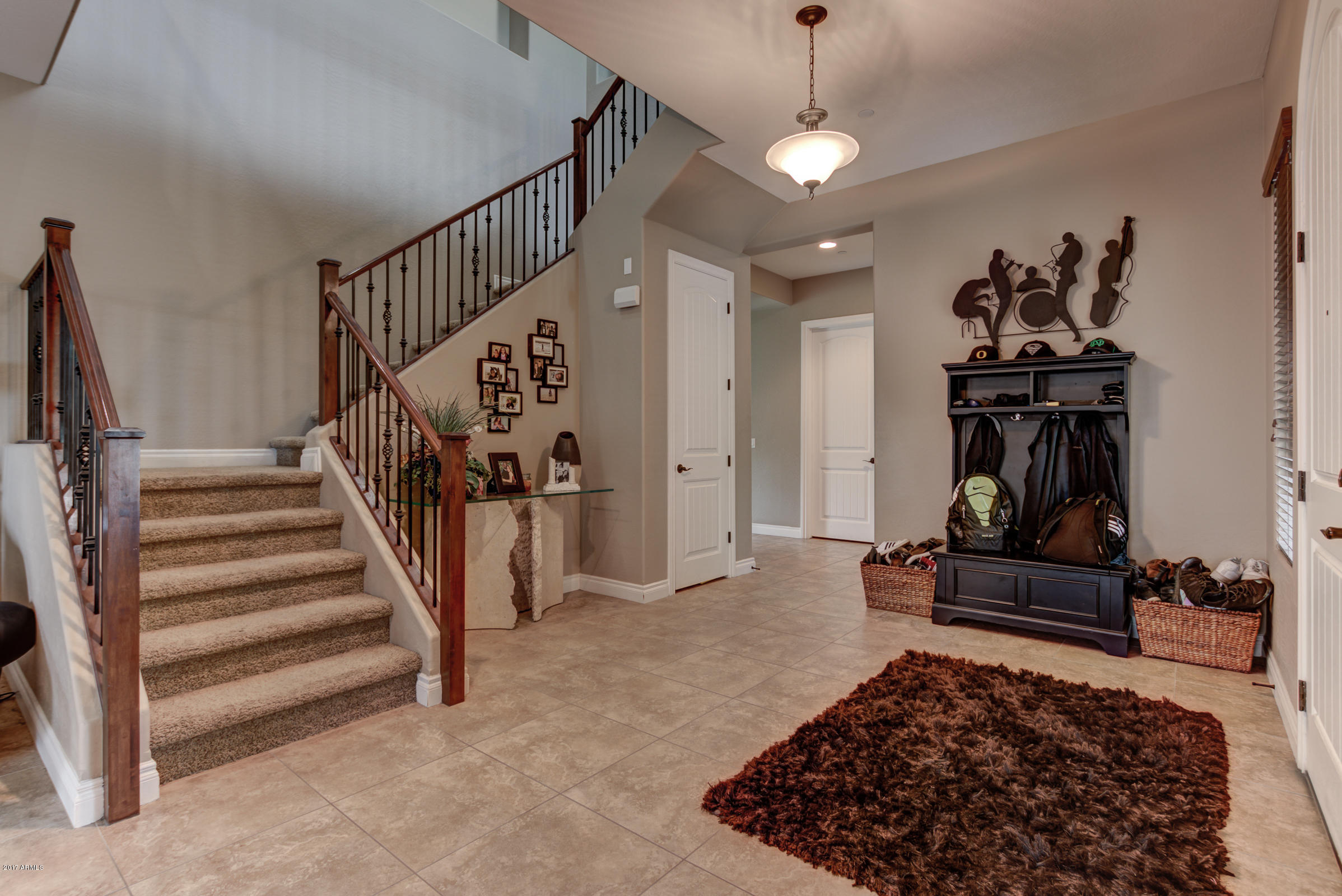 2906 East Blue Sage Road Gilbert, AZ 85297 - Photo 5 of 41 a view of a hallway with wooden floor and entryway