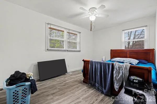 a bedroom with bed and a window