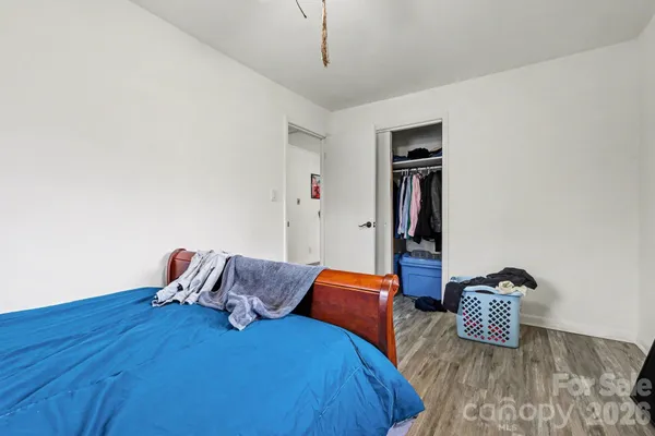 a bedroom with two beds and painted walls