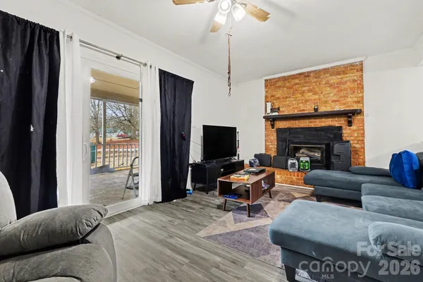 a living room with furniture fireplace and a flat screen tv