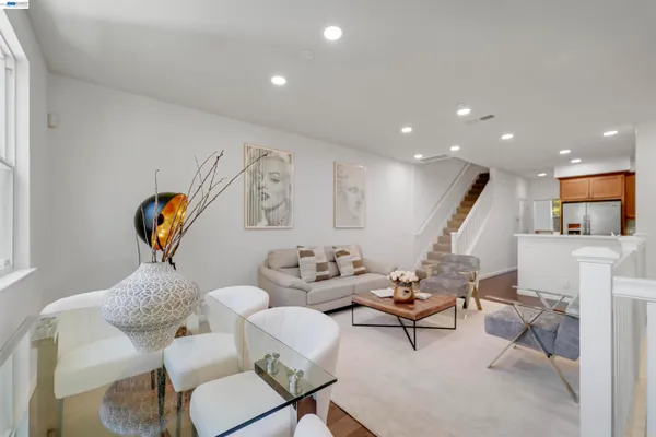 a kitchen with stainless steel appliances granite countertop a stove a refrigerator and a sink