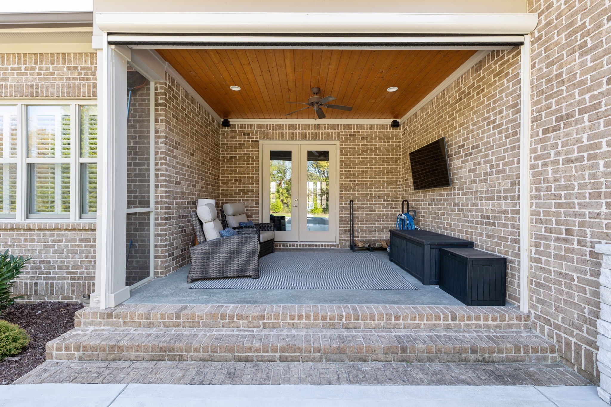 2772 Cabin Run Bridge Road Thompson's Station, TN 37179 - Photo 25 of 98 a living room with fireplace furniture and a flat screen tv