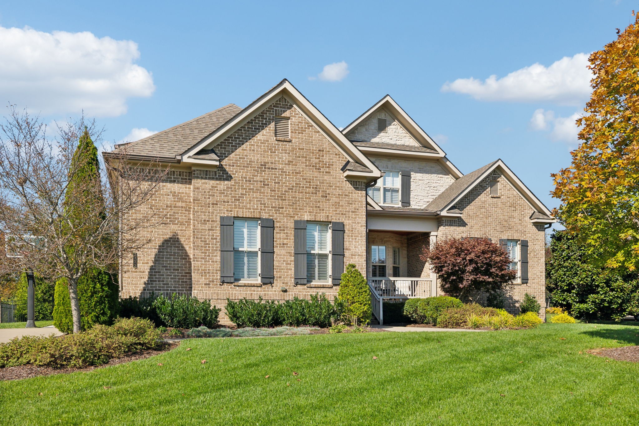 2772 Cabin Run Bridge Road Thompson's Station, TN 37179 - Photo 3 of 98 a front view of a house with a yard and garage