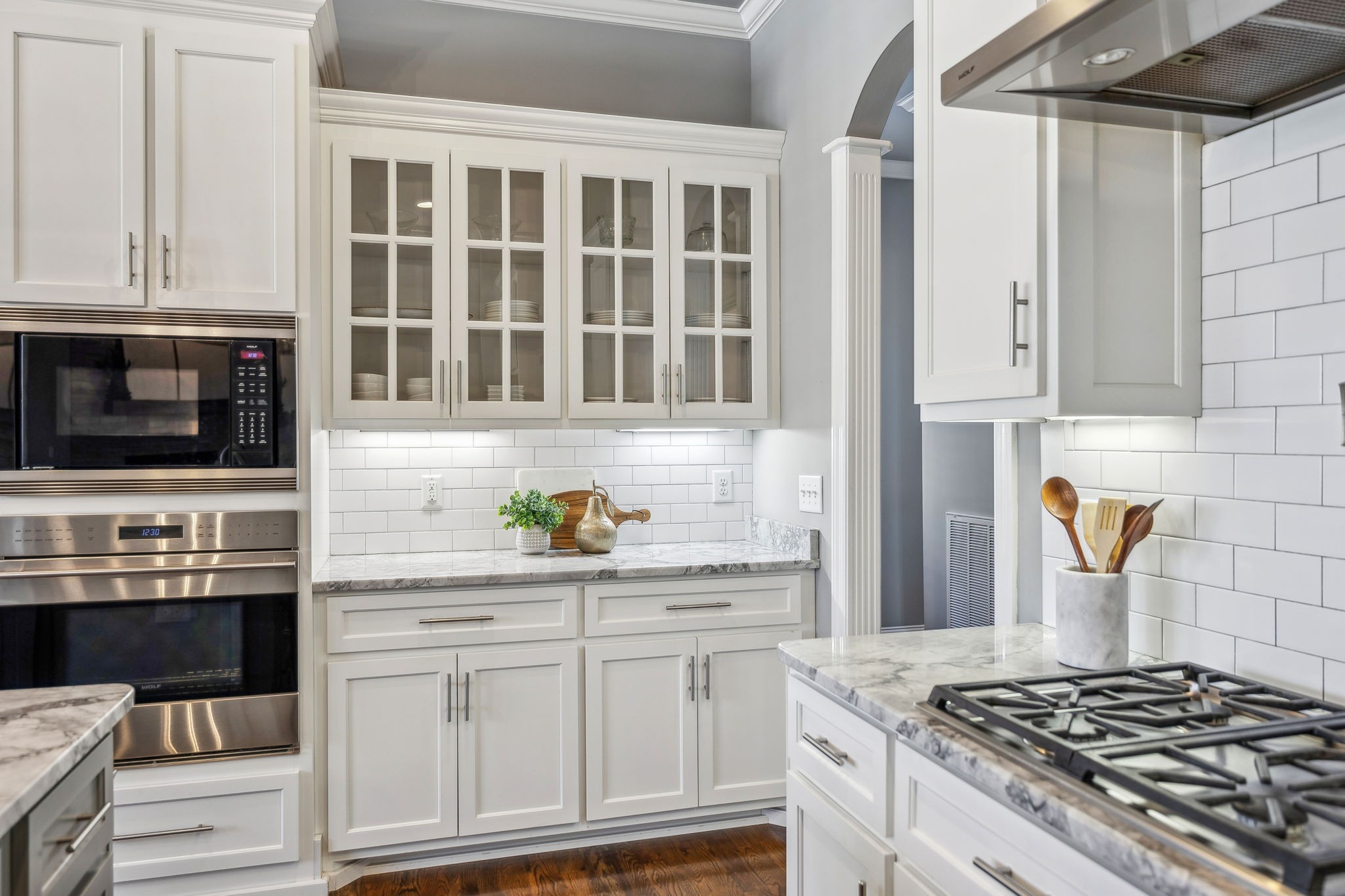 2772 Cabin Run Bridge Road Thompson's Station, TN 37179 - Photo 56 of 98 a kitchen with stainless steel appliances a stove and white cabinets
