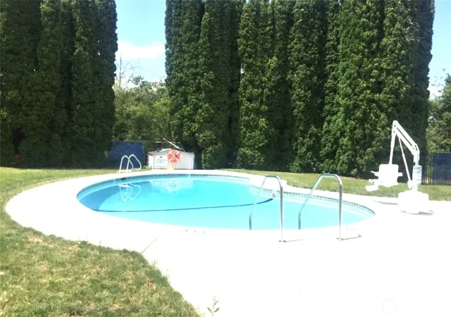 a view of a park with iron fence