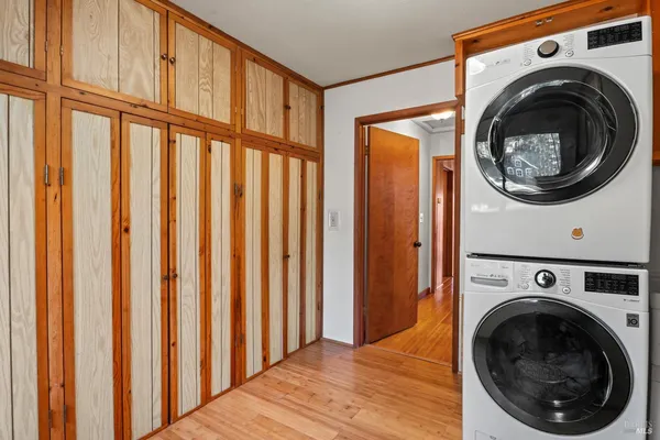 a view of a hallway with washer and dryer