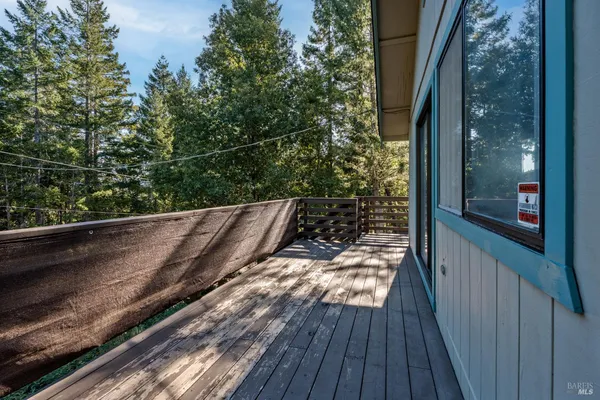 a view of balcony with wooden floor