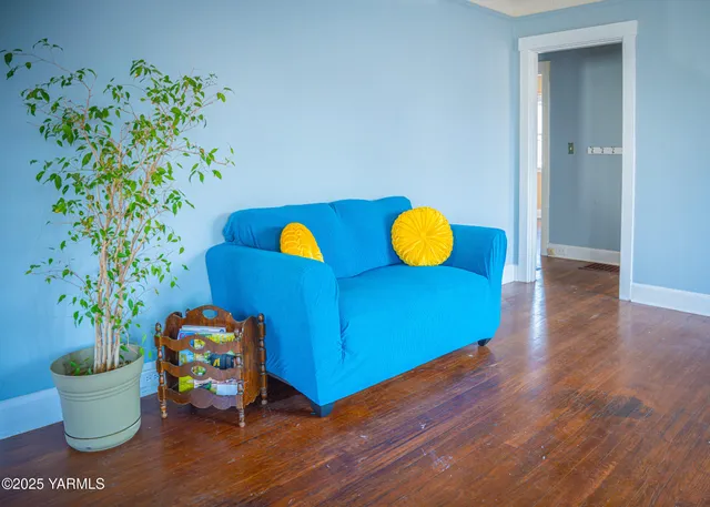 a view of a room with toys and wooden floor