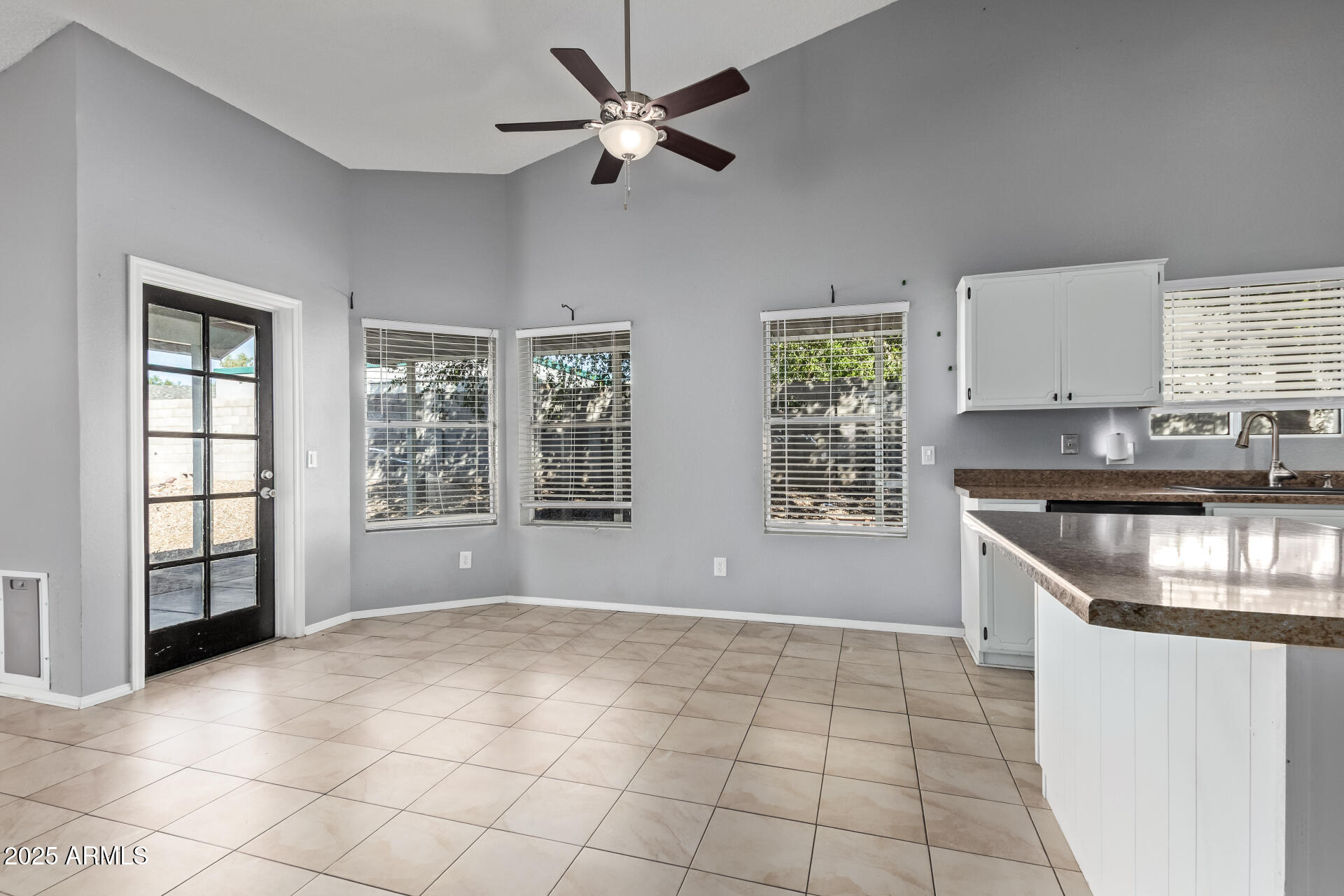 9266 East Quarterline Road Mesa, AZ 85207 - Photo 10 of 31 a kitchen with stainless steel appliances granite countertop a stove a sink and a granite counter tops with white cabinets