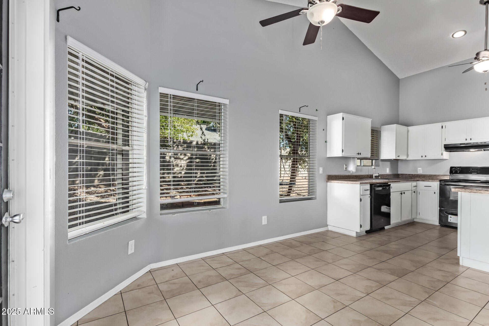 9266 East Quarterline Road Mesa, AZ 85207 - Photo 11 of 31 a open kitchen with white cabinets and white appliances