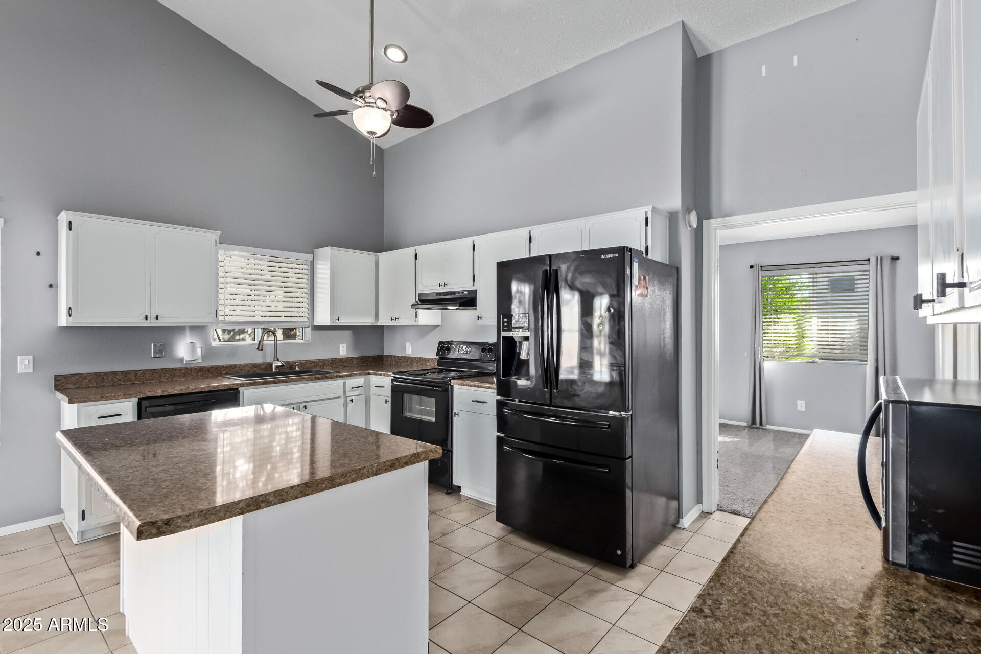 9266 East Quarterline Road Mesa, AZ 85207 - Photo 14 of 31 a kitchen with granite countertop stainless steel appliances and a center island