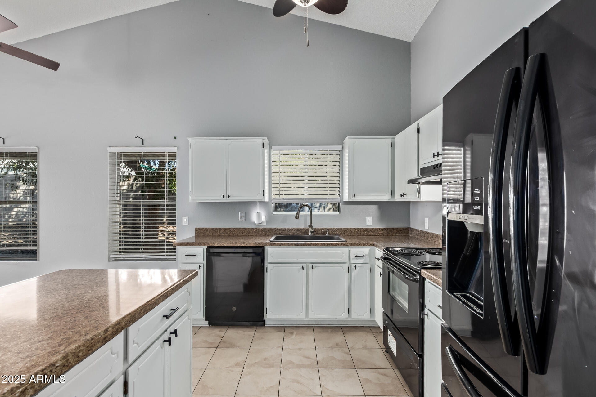 9266 East Quarterline Road Mesa, AZ 85207 - Photo 15 of 31 a kitchen with a sink stove and refrigerator