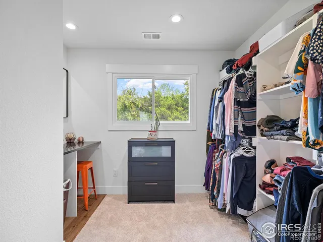 a bathroom with a double vanity sink toilet a shower and a mirror