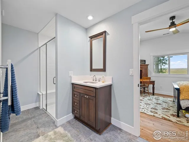 a bathroom with a glass shower door