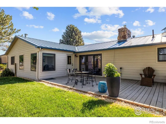a front view of house with outdoor seating