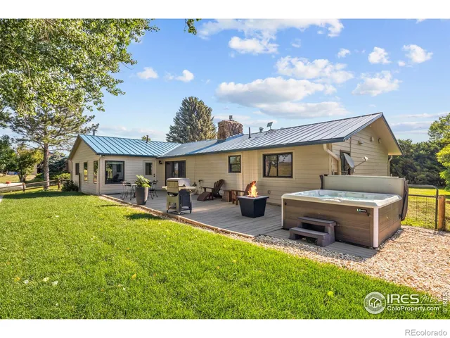 a view of a lake with chairs