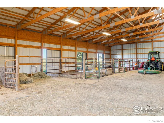 a living room with furniture a window and a potted plant