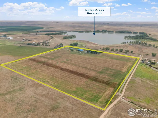 a view of a pool with an outdoor seating