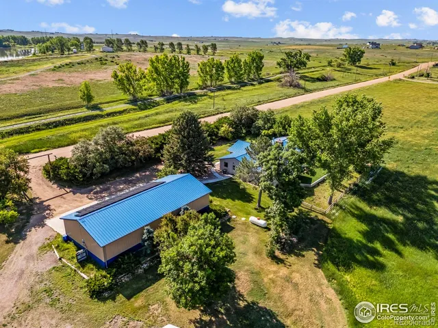 a view of a field with an ocean
