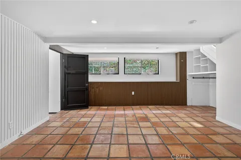 a view of a bedroom with closet and windows