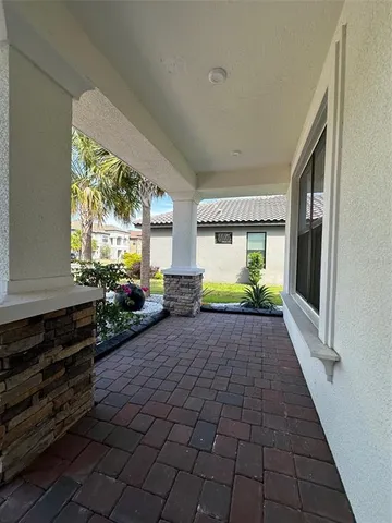a kitchen with granite countertop stainless steel appliances and white cabinets