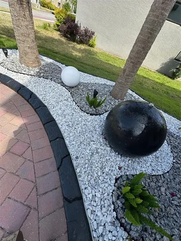 a kitchen with granite countertop a sink stainless steel appliances and cabinets