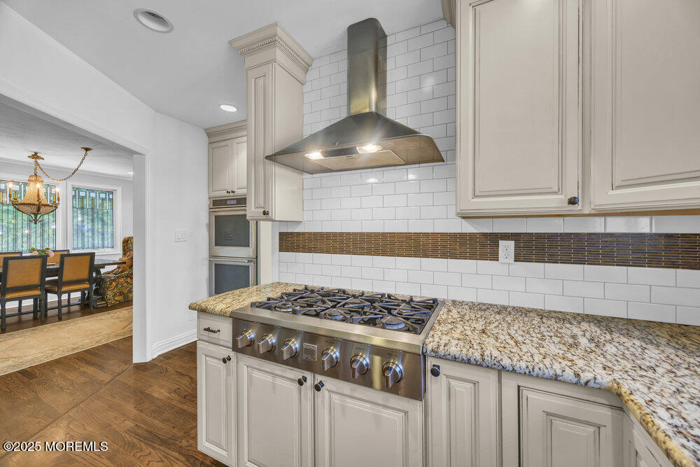 412 Brighton Avenue Spring Lake, NJ 07762 - Photo 13 of 56 a kitchen with granite countertop a stove and a sink