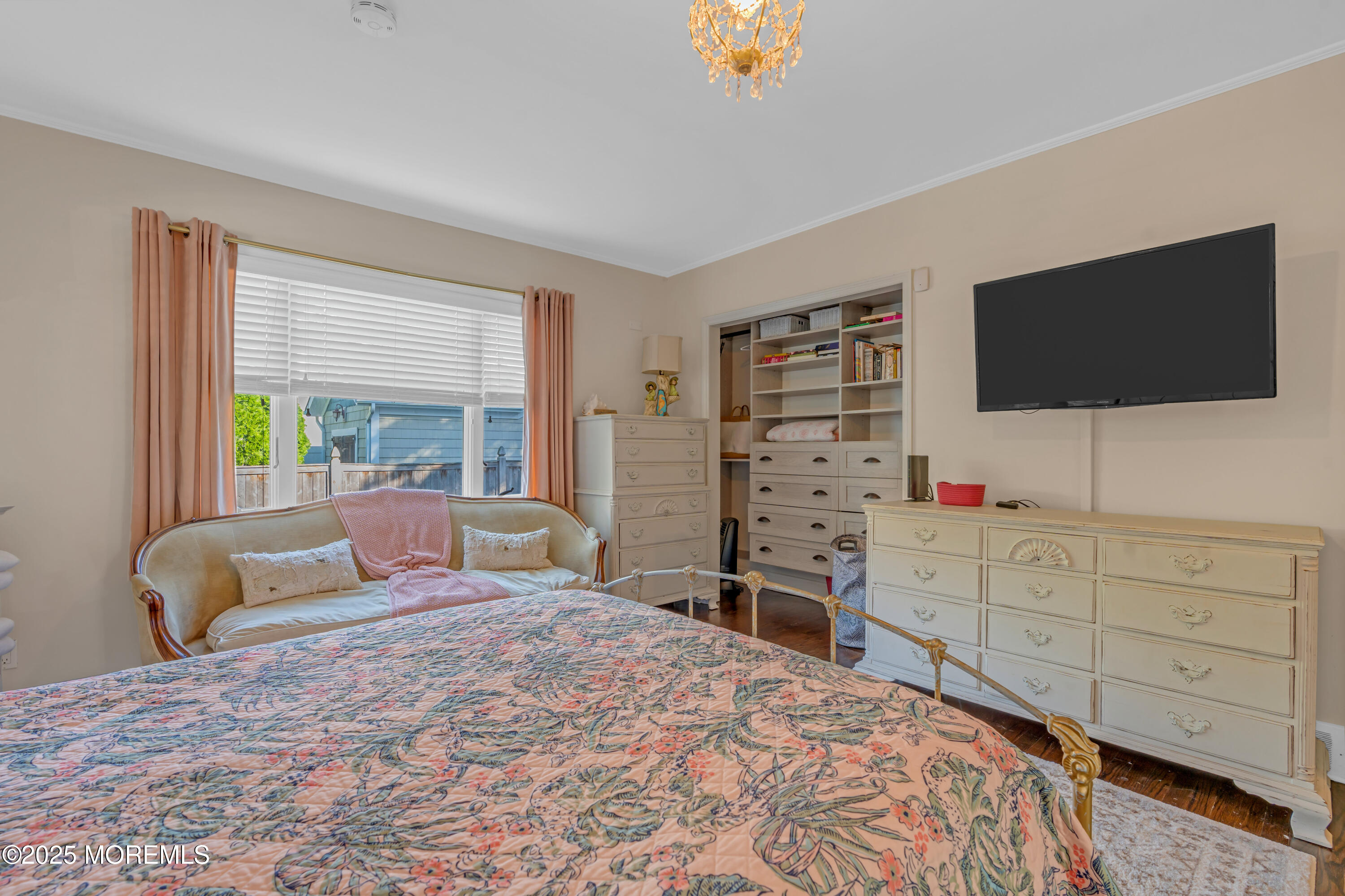 412 Brighton Avenue Spring Lake, NJ 07762 - Photo 20 of 56 a bedroom with a large bed and a flat screen tv