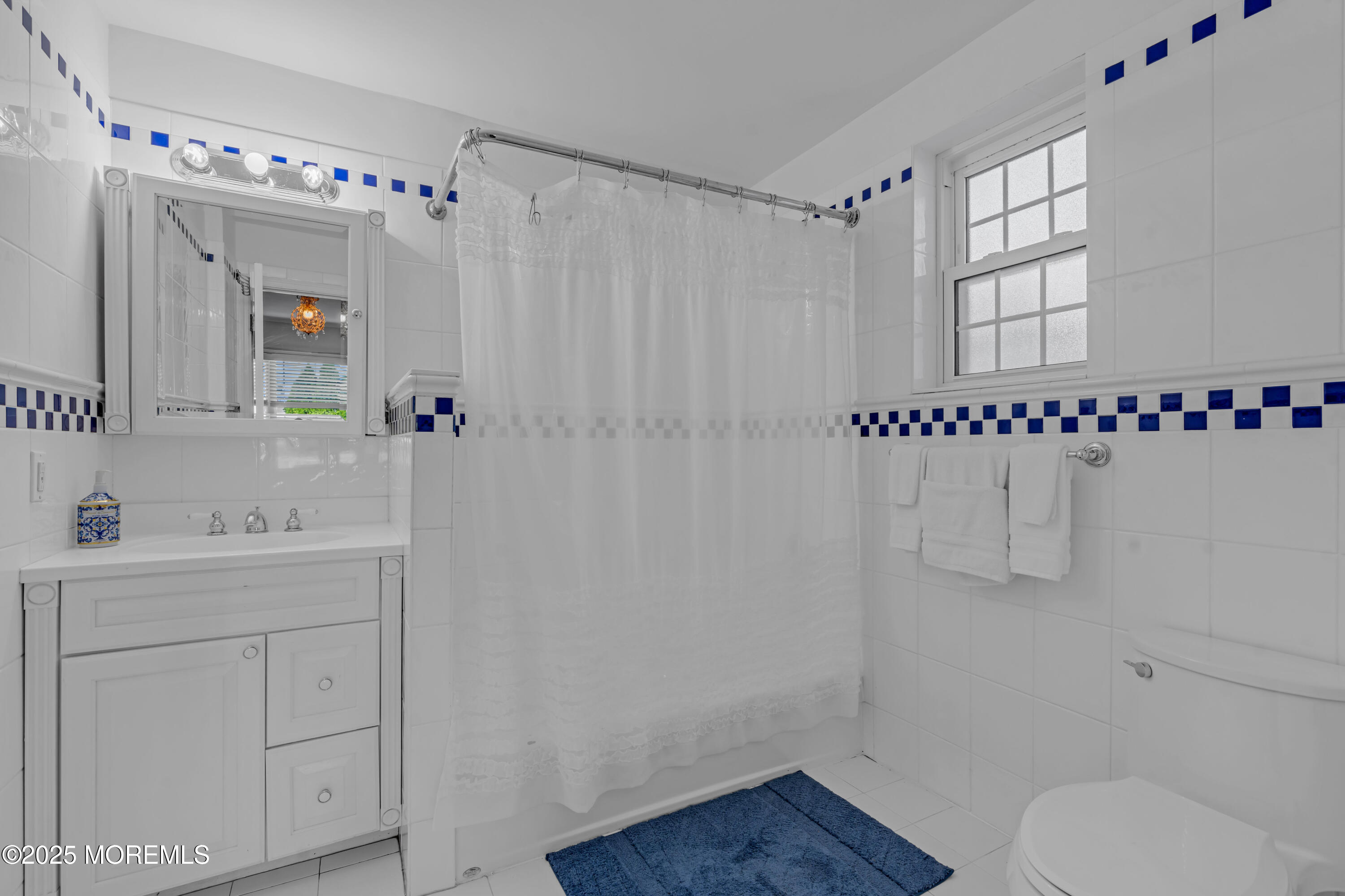 412 Brighton Avenue Spring Lake, NJ 07762 - Photo 22 of 56 a bathroom with a sink a toilet and shower