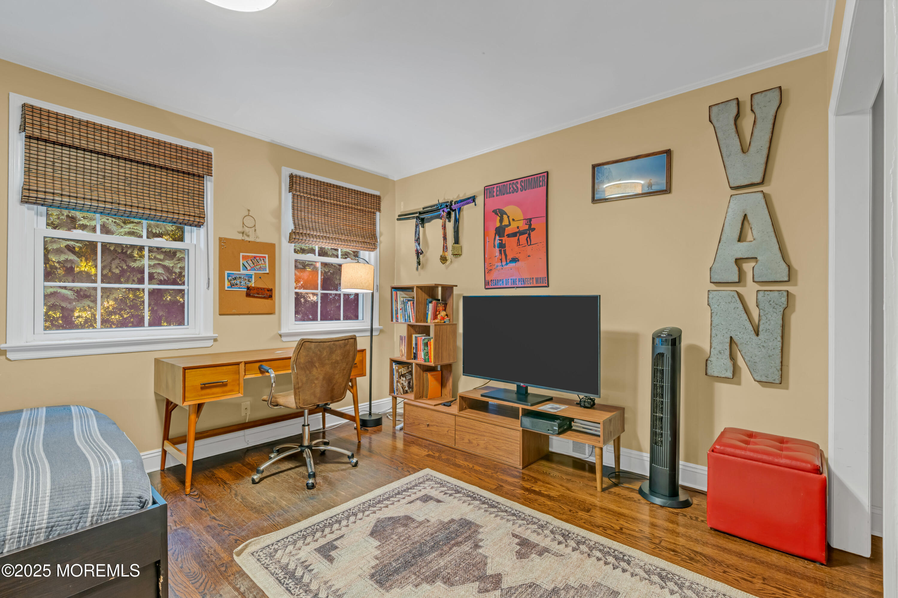 412 Brighton Avenue Spring Lake, NJ 07762 - Photo 24 of 56 a living room with furniture and a flat screen tv with wooden floor