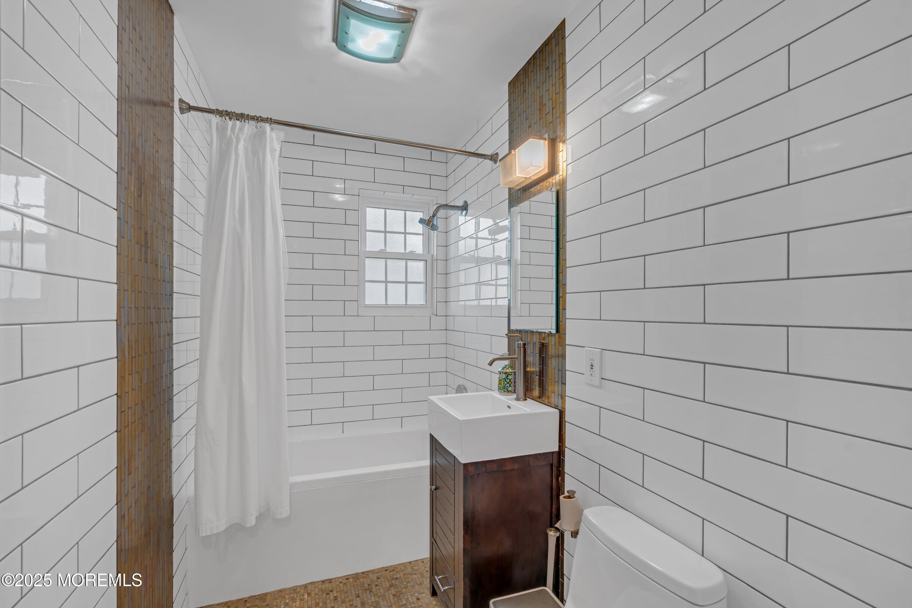 412 Brighton Avenue Spring Lake, NJ 07762 - Photo 25 of 56 a bathroom with a bathtub and shower