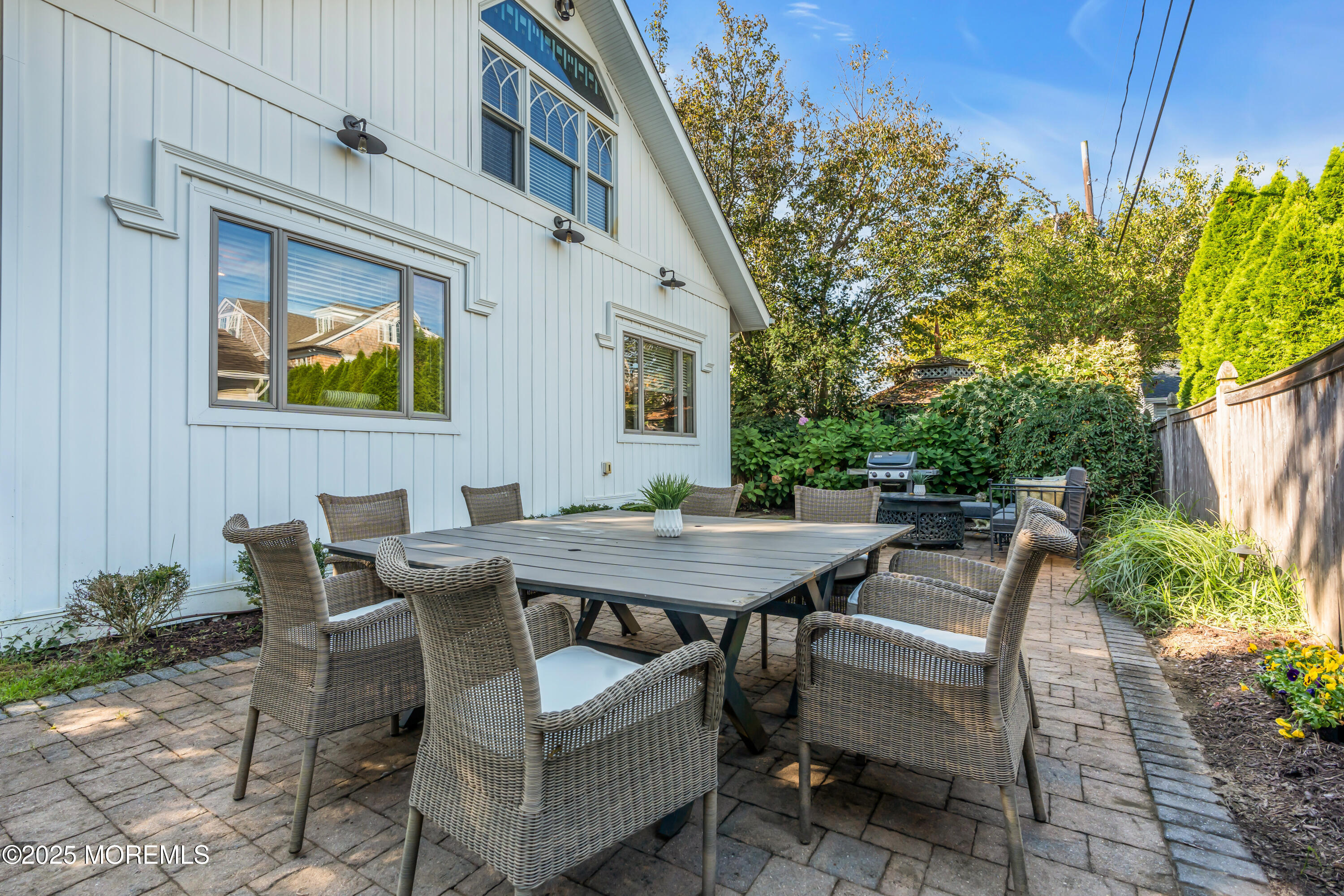 412 Brighton Avenue Spring Lake, NJ 07762 - Photo 40 of 56 a view of a patio with a table and chairs